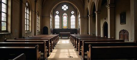 A decrepit church adorned by stainedglass windows and empty pews photo