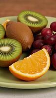 Fruit salad containing kiwi grape orange and kiwi pieces photo