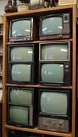 Antique shop showcases assorted television designs through various decades photo