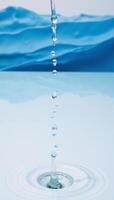 Isolated water droplets against a bluetoned abstract backdrop with hints of a water wave photo
