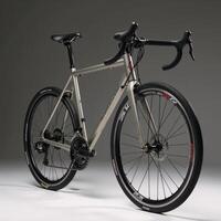A fullsized bicycle against a backdrop photo