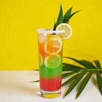 A vibrant tropicalinspired cocktail with lemon and palm leaves against a sunny yellow backdrop photo