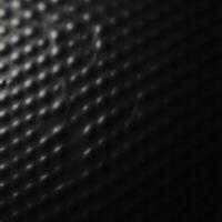 A black textured gradient background featuring an uneven matte surface photo