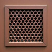 Rusty metal panel with rectangular vent circular hole pattern photo