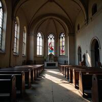 A decrepit church adorned by stainedglass windows and empty pews photo