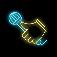Hand holding a microphone with neon light effect vector