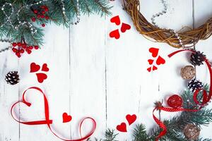 Valentine's day background, hearts and branches of a Christmas tree on a white tree. place for text. top view photo