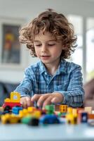 Young boy joyfully playing with colorful building blocks at home on a sunny afternoon photo