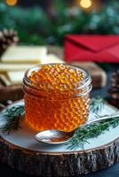 Fresh salmon roe served in a jar with herbs on a wooden board during daylight hours photo