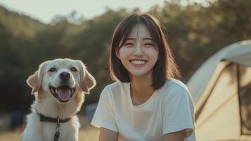 A joyful moment by the campsite with a dog under the warm sun surrounded by trees photo
