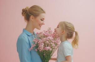 A joyful mother and daughter share a special moment with pink flowers against a pastel background photo