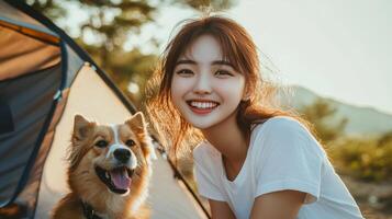 A joyful moment by the campsite with a dog under the warm sun surrounded by trees photo