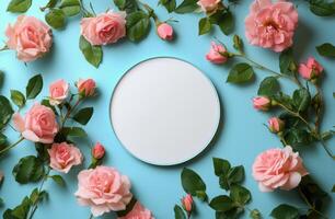 Elegant arrangement of pink roses surrounding a blank plate on a soft pink background photo