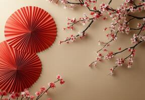 Elegant display of cherry blossoms and paper fans on a light background for spring decor photo