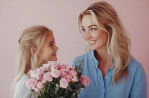 A joyful mother and daughter share a special moment with pink flowers against a pastel background photo