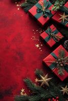 Festive holiday gifts arranged on a vibrant red background with decorative elements and greenery photo