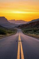 Scenic highway winding through mountains at sunset with vibrant sky and soft shadows photo