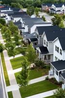 Charming modern townhouses with a sunset backdrop in a serene neighborhood during evening hours photo