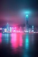 Vibrant nighttime skyline of Hong Kong with colorful lights reflecting on the water photo