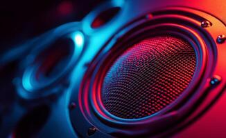 Colorful close up of a speaker cone illuminated by vibrant LED lights at a sound event photo