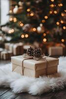 A wrapped gift with pine cones rests on a fluffy rug by a decorated Christmas tree photo