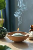 Tranquil incense burning with lotus and candle in serene indoor setting during twilight photo