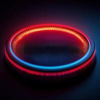 Modern audio speaker illuminated with red and blue lights against a dark background photo