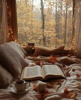 Cozy reading nook with warm colors and autumn leaves, perfect for a rainy day retreat photo