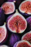 Freshly sliced figs displaying vibrant color and intricate texture on a dark background photo