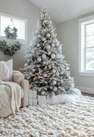 A beautifully decorated Christmas tree with ornaments and presents in a cozy living room setting photo