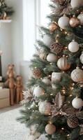 Decorated Christmas tree with elegant ornaments and warm lights in a cozy living room photo