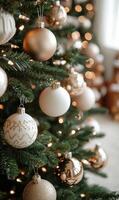 Decorated Christmas tree with elegant ornaments and warm lights in a cozy living room photo