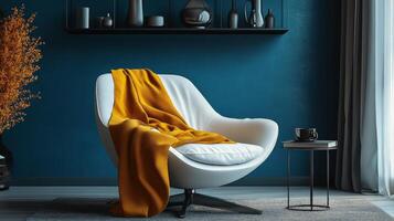Cozy modern living room with a stylish chair and vibrant throw in a serene blue interior setting photo