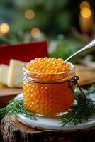 Fresh salmon roe served in a jar with herbs on a wooden board during daylight hours photo