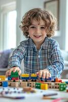Young boy joyfully playing with colorful building blocks at home on a sunny afternoon photo
