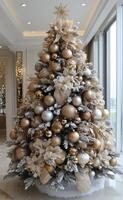 Festively decorated Christmas tree with gold ornaments in a cozy living room setting photo