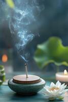 Tranquil incense burning with lotus and candle in serene indoor setting during twilight photo