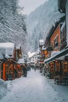 Snow covered village street in winter with shops and visitors enjoying the scenery photo