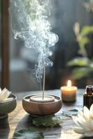 Tranquil incense burning with lotus and candle in serene indoor setting during twilight photo