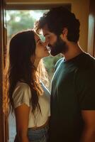Romantic moment between a couple indoors during early evening light photo