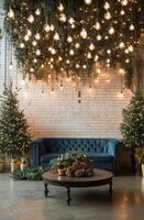 Cozy holiday living room with a blue sofa and beautifully adorned evergreen backdrop photo
