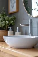 Modern bathroom design featuring a stylish sink, greenery, and natural decor elements photo