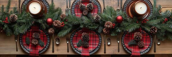 A beautifully decorated holiday dining table with pine branches and festive candles in winter photo