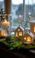 A cozy, illuminated ceramic house nestled among moss in a tranquil forest setting at dusk photo