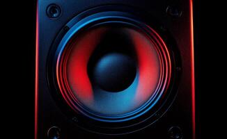 Colorful close up of a speaker cone illuminated by vibrant LED lights at a sound event photo