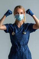 A healthcare worker confidently poses with gloves and mask, showcasing strength and dedication photo