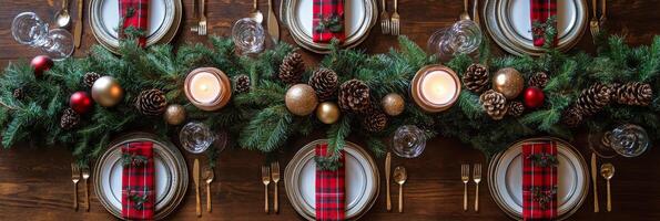 A beautifully decorated holiday dining table with pine branches and festive candles in winter photo