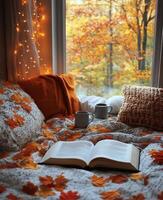 Cozy reading nook with warm colors and autumn leaves, perfect for a rainy day retreat photo