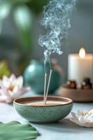 Tranquil incense burning with lotus and candle in serene indoor setting during twilight photo