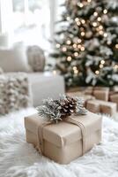 A wrapped gift with pine cones rests on a fluffy rug by a decorated Christmas tree photo